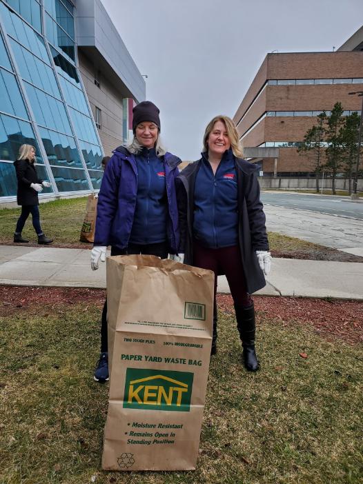 Facilities Management employees Susan Lane and Marlyce Poole at campus cleanup.